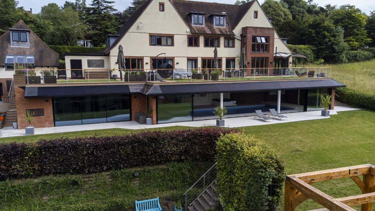 20-metre wide Minimalist Sliding Doors add the Wow Factor to the Arts and Crafts Style Property, Guildford