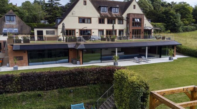 20-metre wide Minimalist Sliding Doors add the Wow Factor to the Arts and Crafts Style Property, Guildford