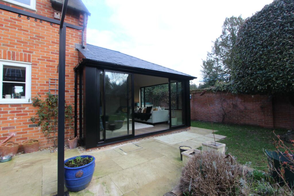 Black Warm Roof Conservatory with Slimline Sliding Doors, Oxford