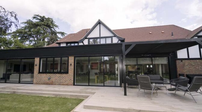 Floor-to-Ceiling Slim Sliding Doors brings outdoor living to a 1930s-period house Renovation, Cobham in Surrey