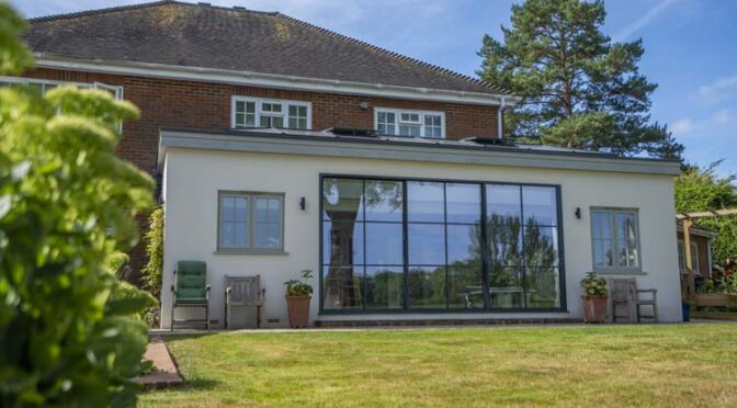 Ultra Slim Steel-look Sliding Doors for White Rendered Extension, Effingham, Surrey