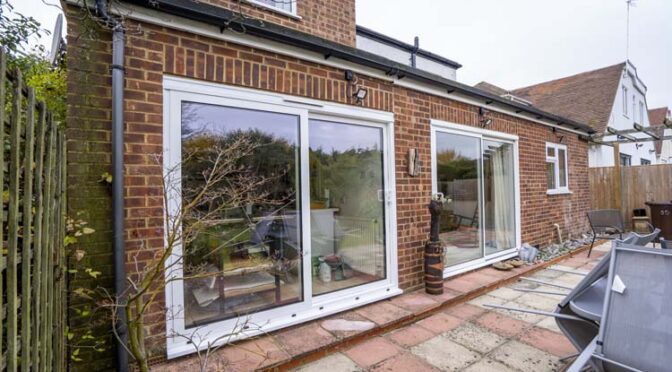 White Two-Pane Hi Inline Sliding Door Enhances Natural Light in an Artist Studio, Earley near Wokingham, Berkshire